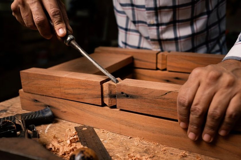 A dovetail joint and a doweled joint drawn side by side on a technical sheet