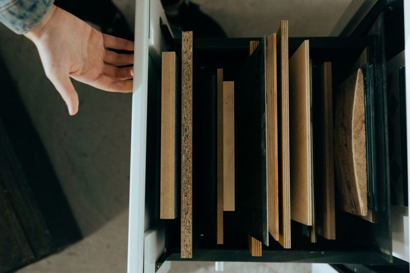 A drawer front with a visible gap on one side, held up to a square